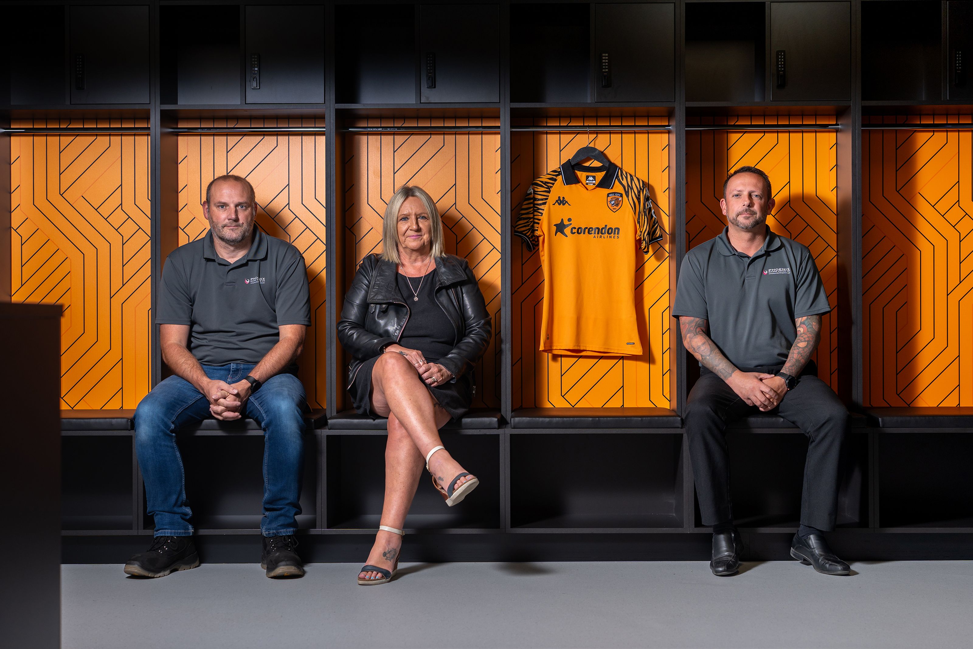 Members of the team sat in the Hull City Football Team changing room.