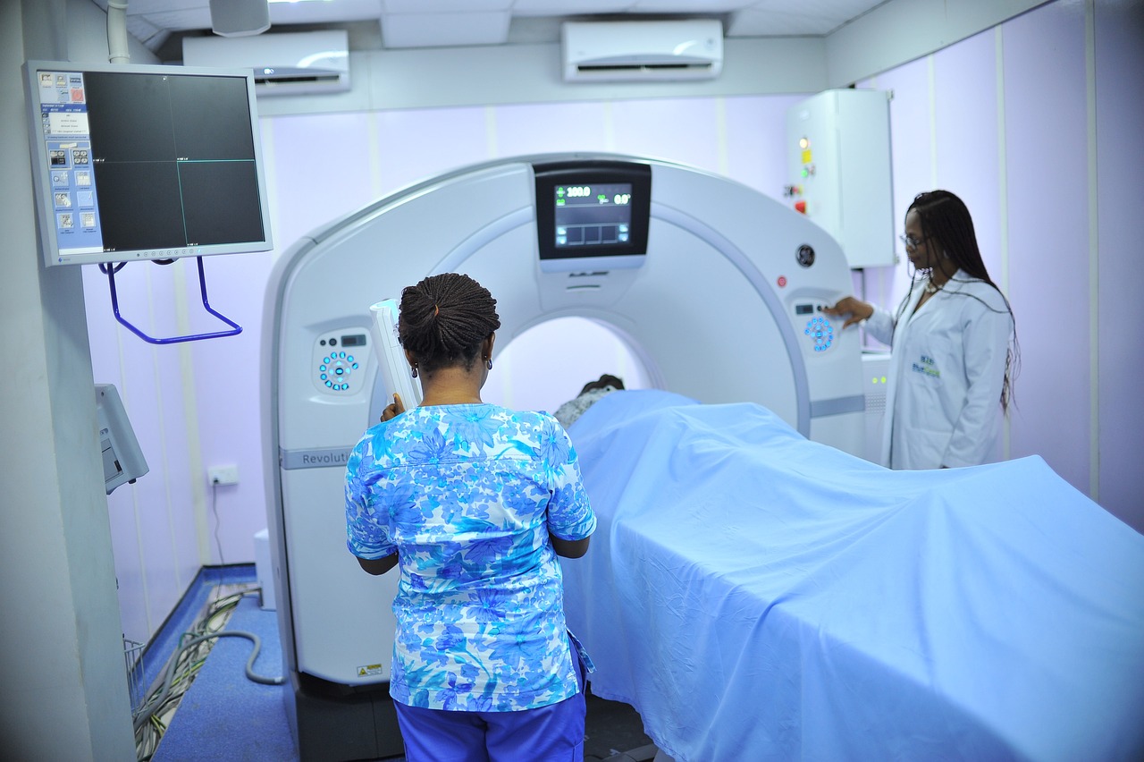MRI Scan with two operatives and a patient.